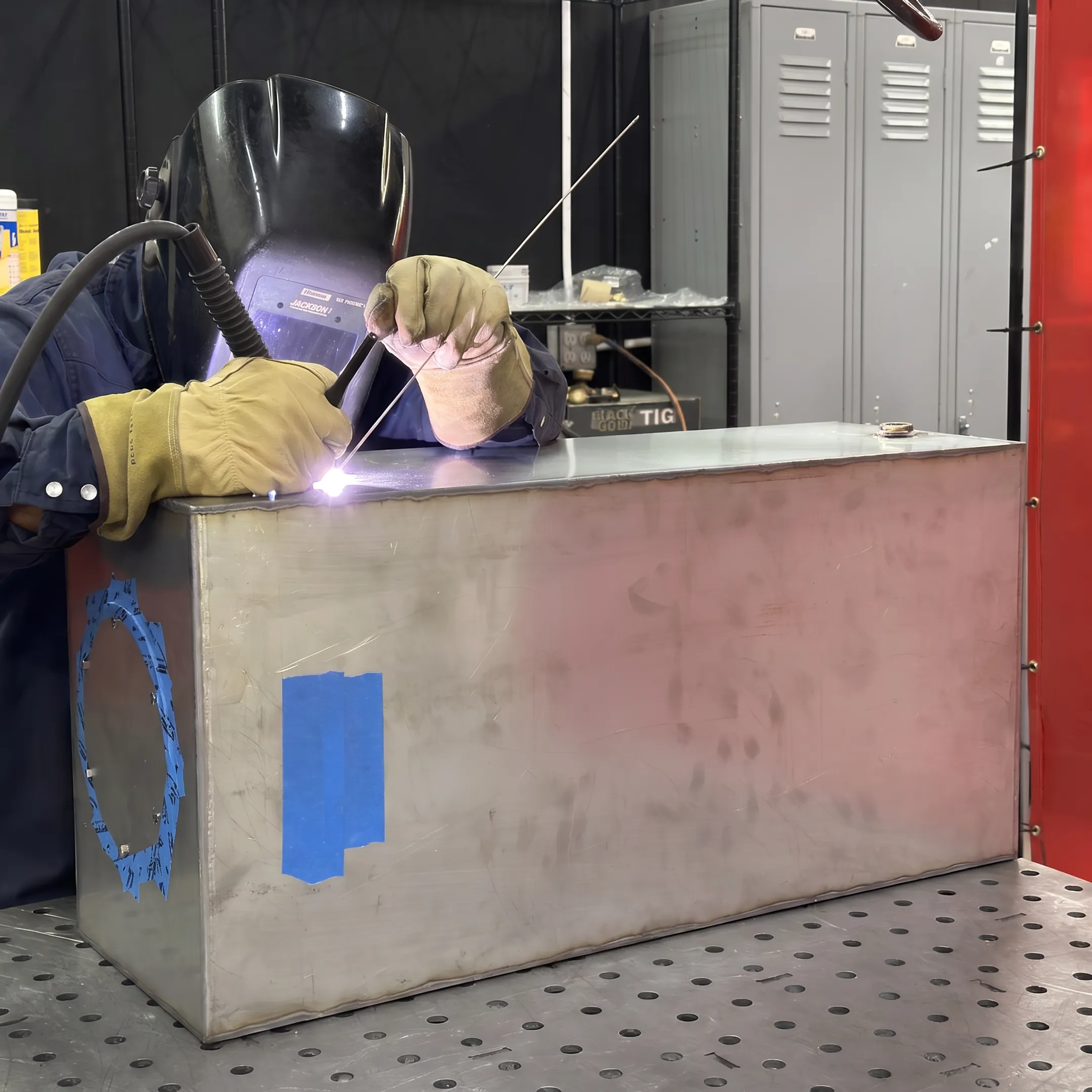 Welder fabricating a precision metal assembly