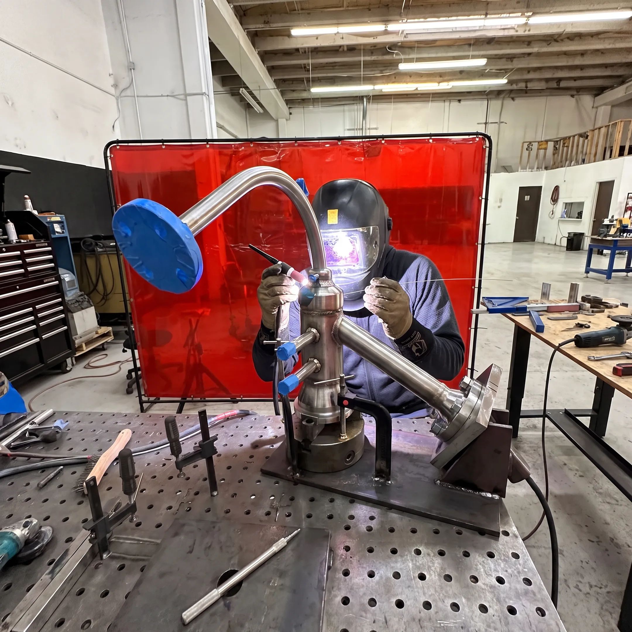 Precision welding and advanced metal fabrication in a technical workshop