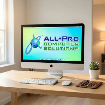 iMac computer displaying a clean desktop after a successful repair