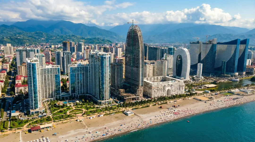 Batumi Black Sea beachfront skyline with high-rise apartment towers and coastline