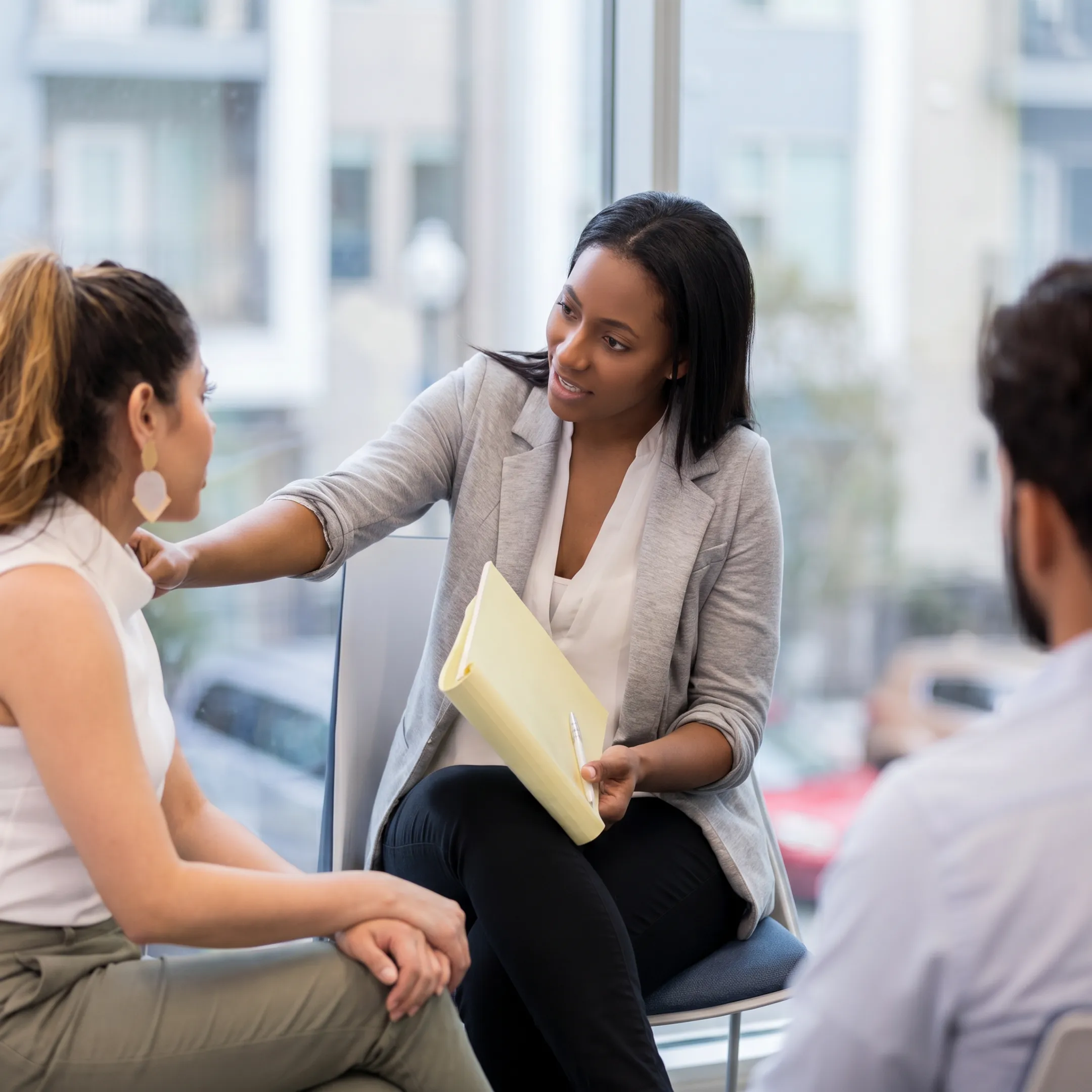 Adult client meeting with a therapist during personalized depression treatment