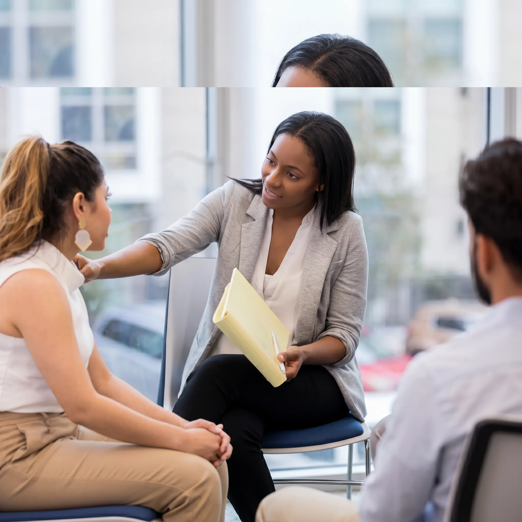 Therapist meeting with an adult client in a calm behavioral health treatment setting