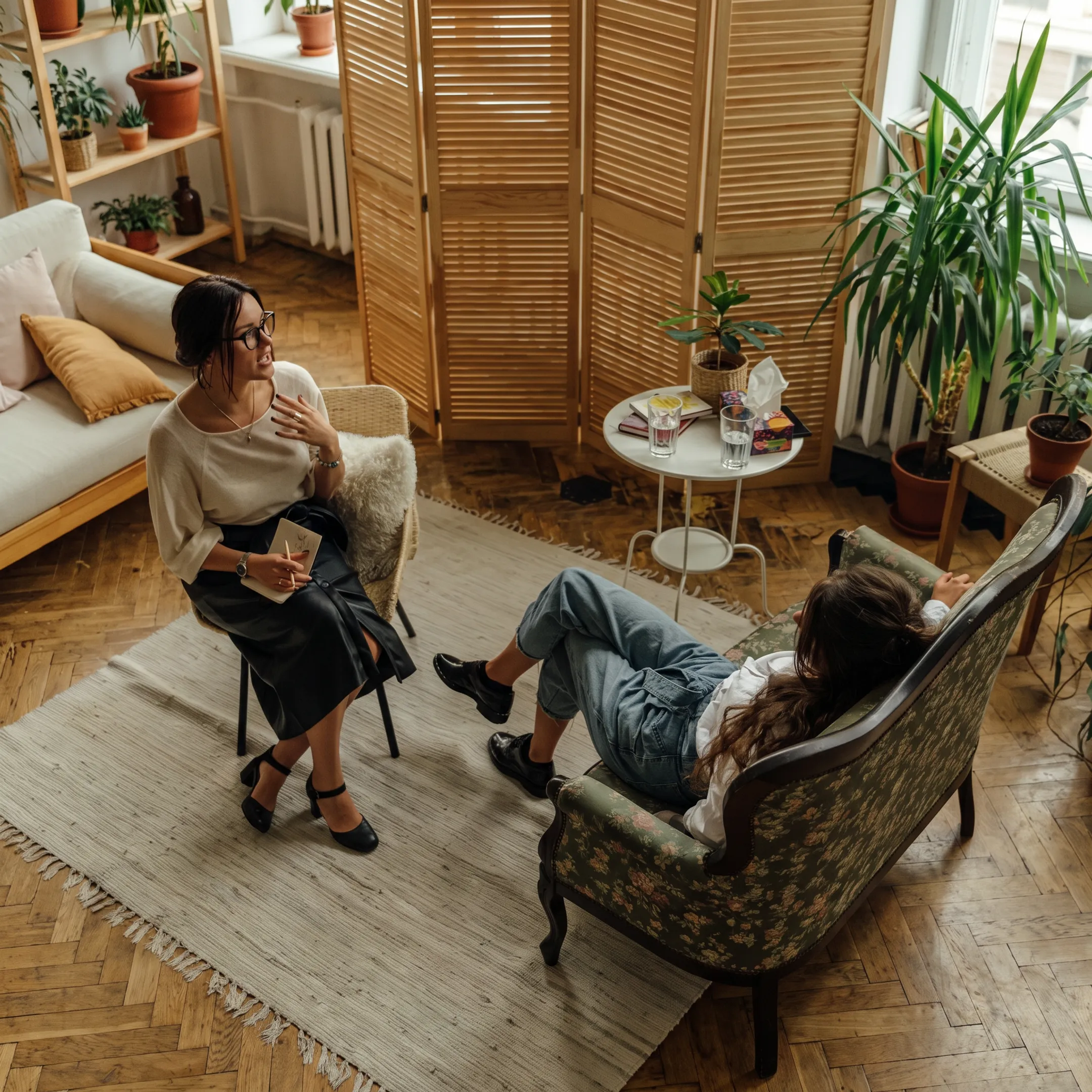 Clinician providing personalized mental health support to an adult client