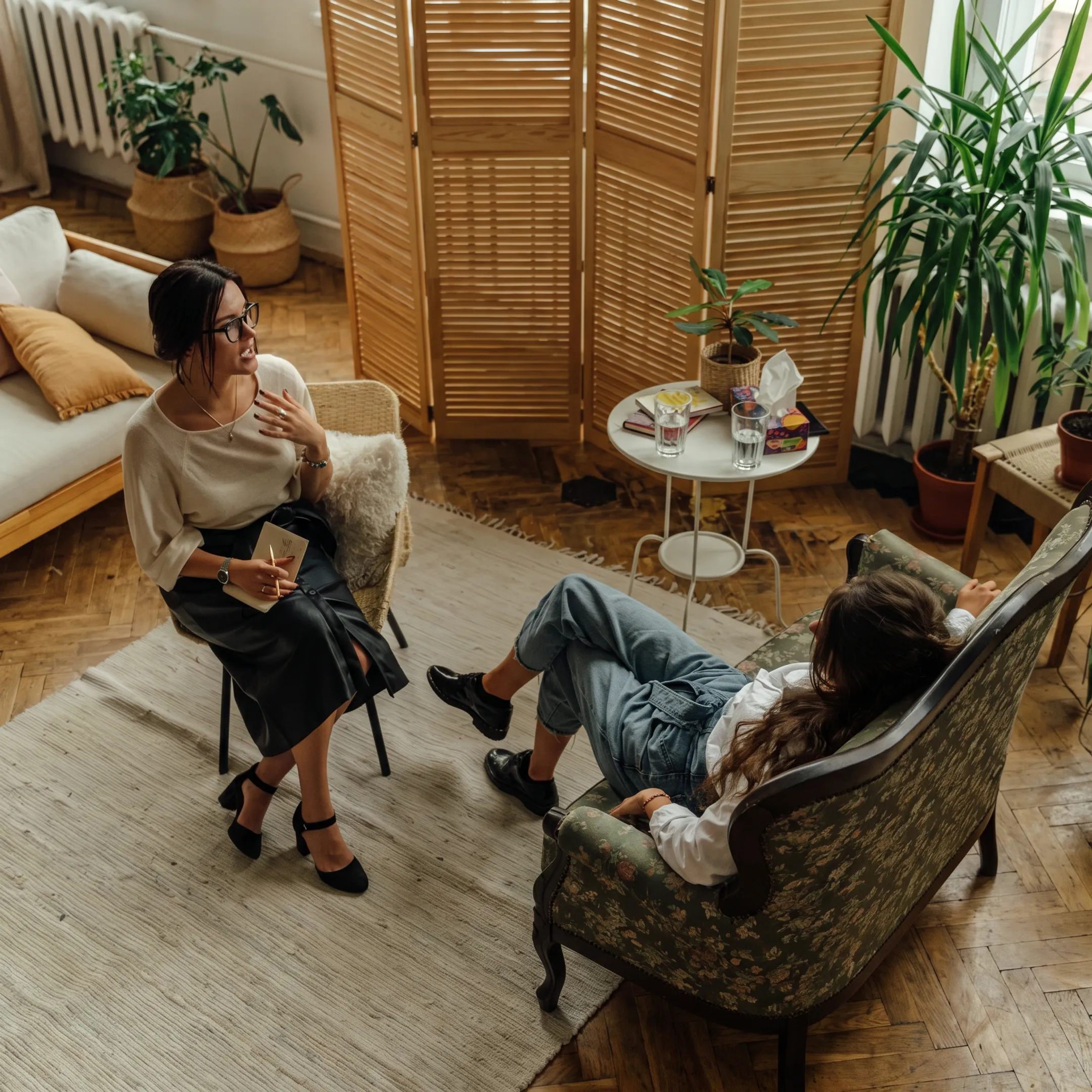 Behavioral health clinician guiding an adult client through personalized treatment planning