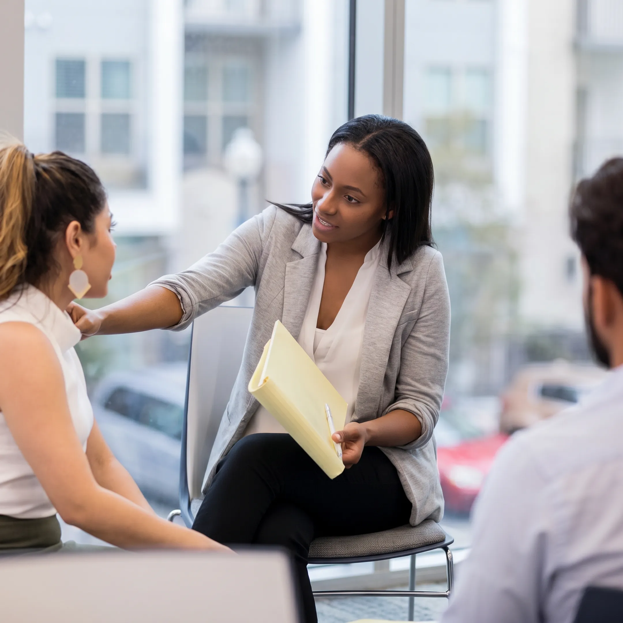 Behavioral health professional reviewing PHP coverage information with a client