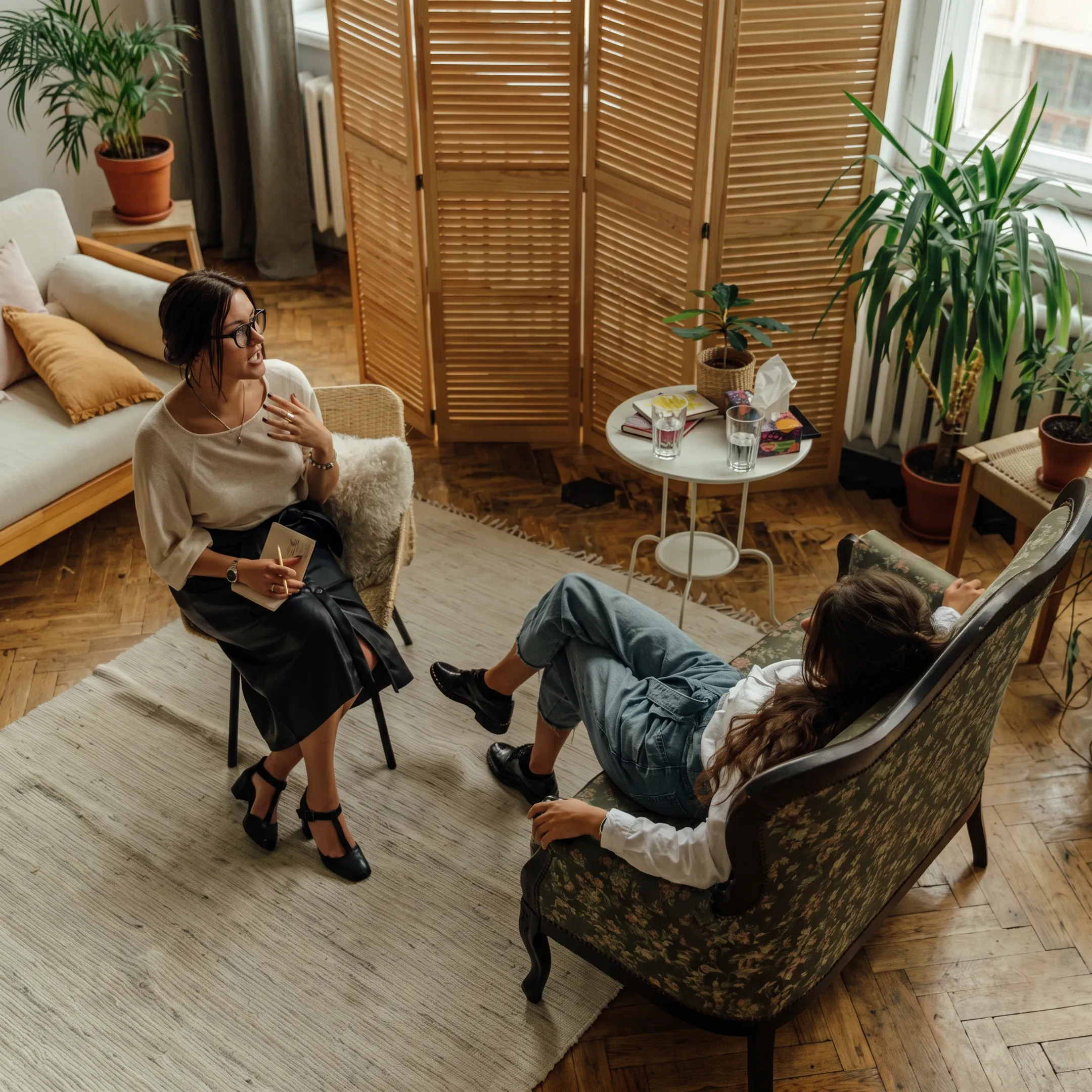 Adult client speaking with a behavioral health clinician in residential care