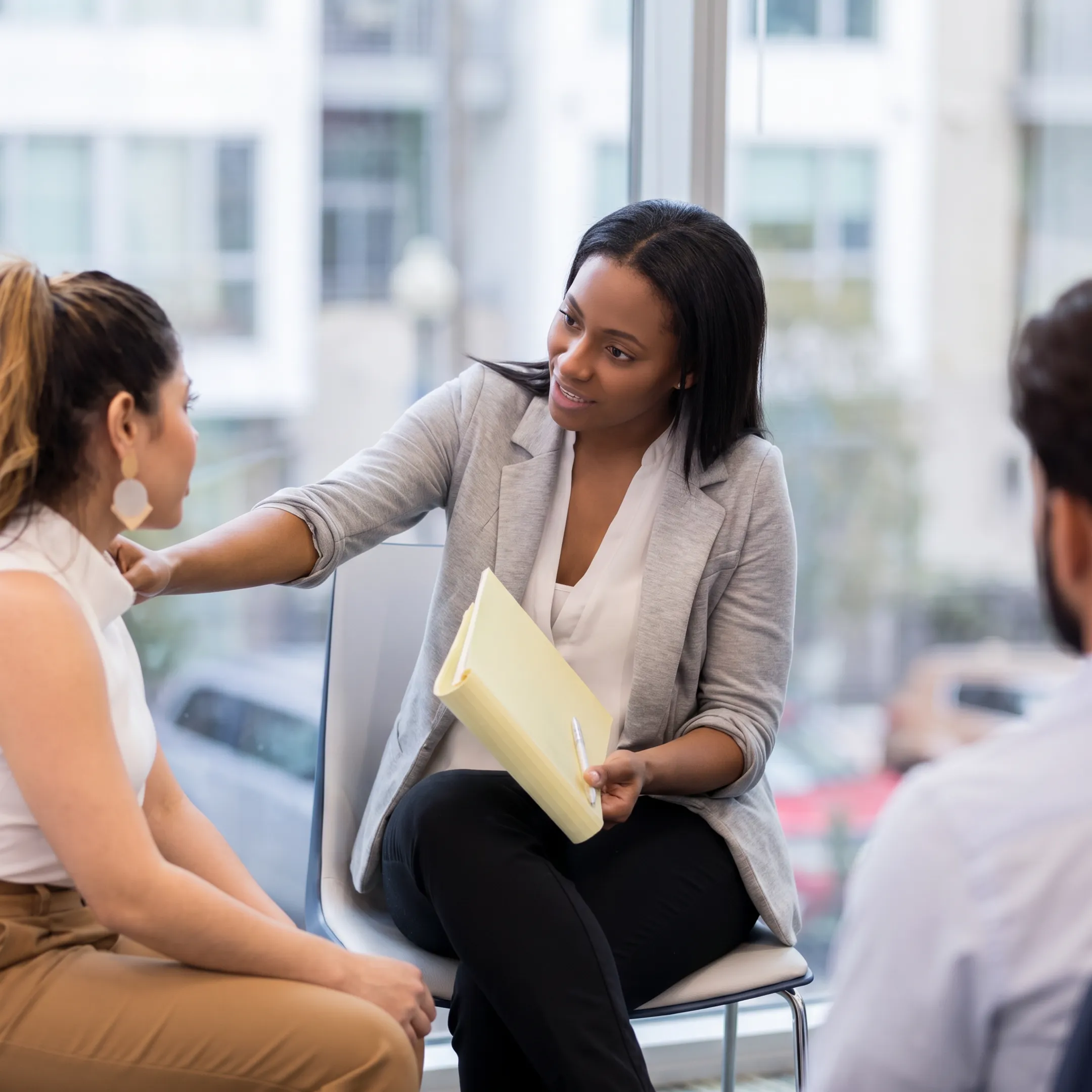 Behavioral health care team supporting an adult client during personalized treatment planning