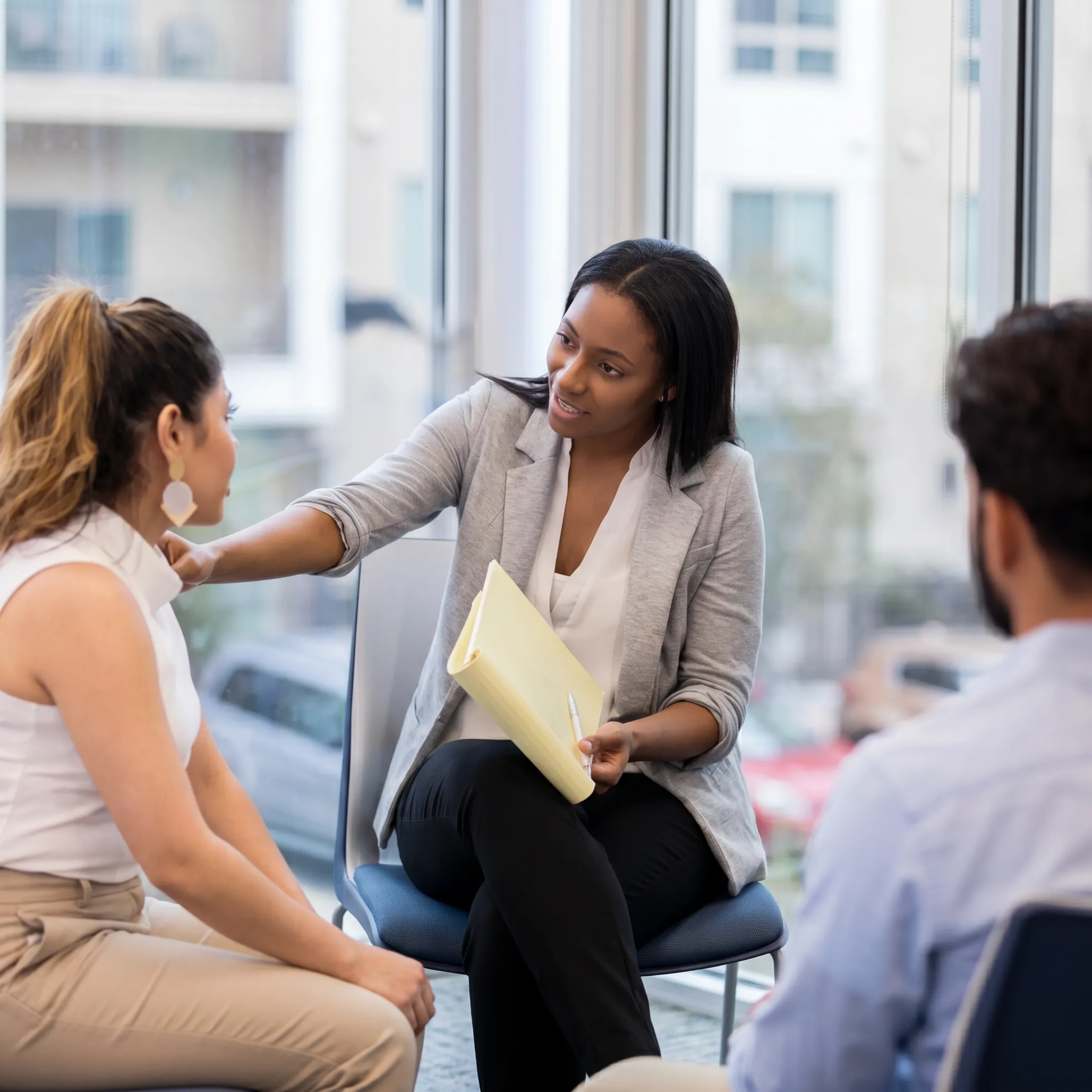Behavioral health admissions specialist explaining rehab insurance benefits
