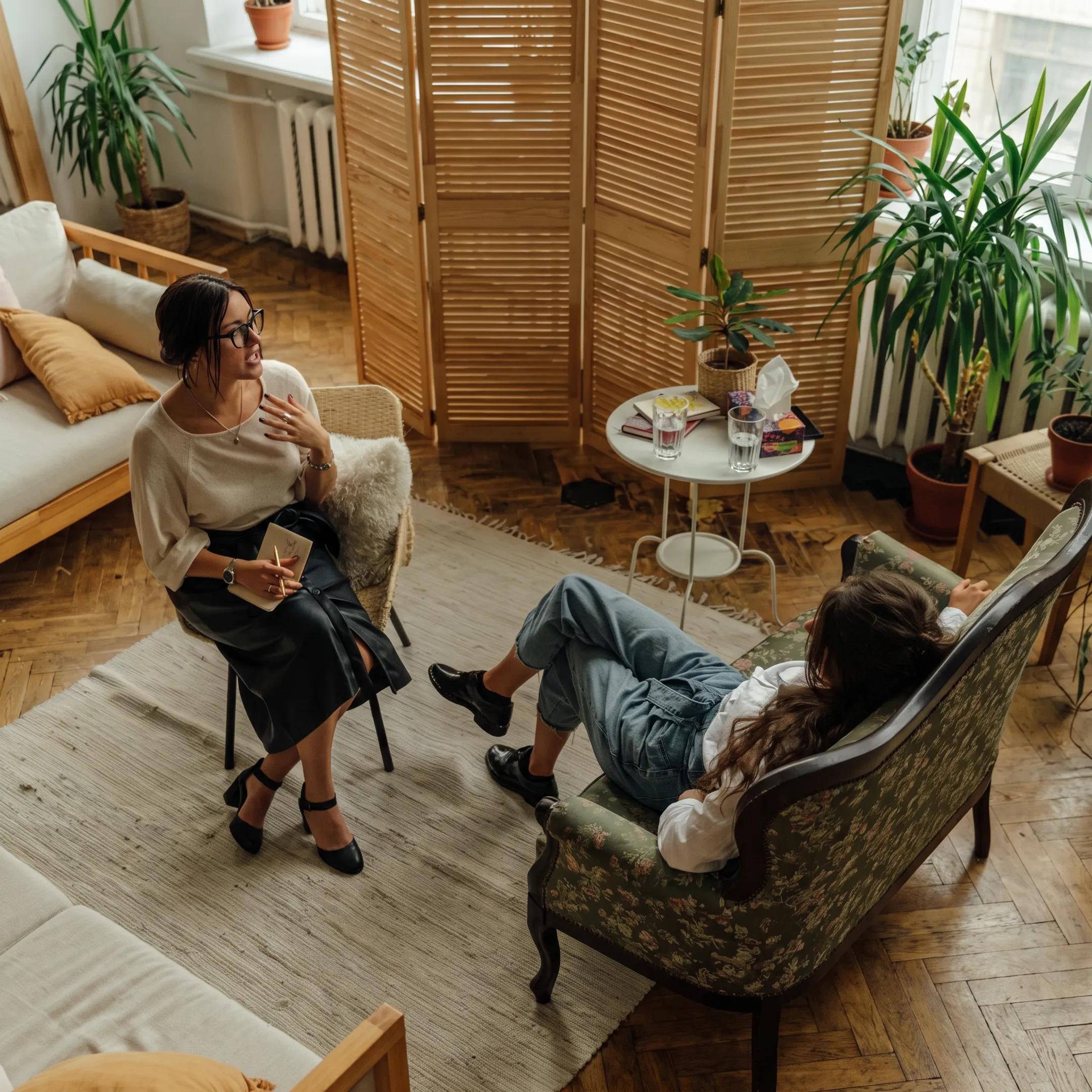 Behavioral health professional reviewing evaluation information with an adult client