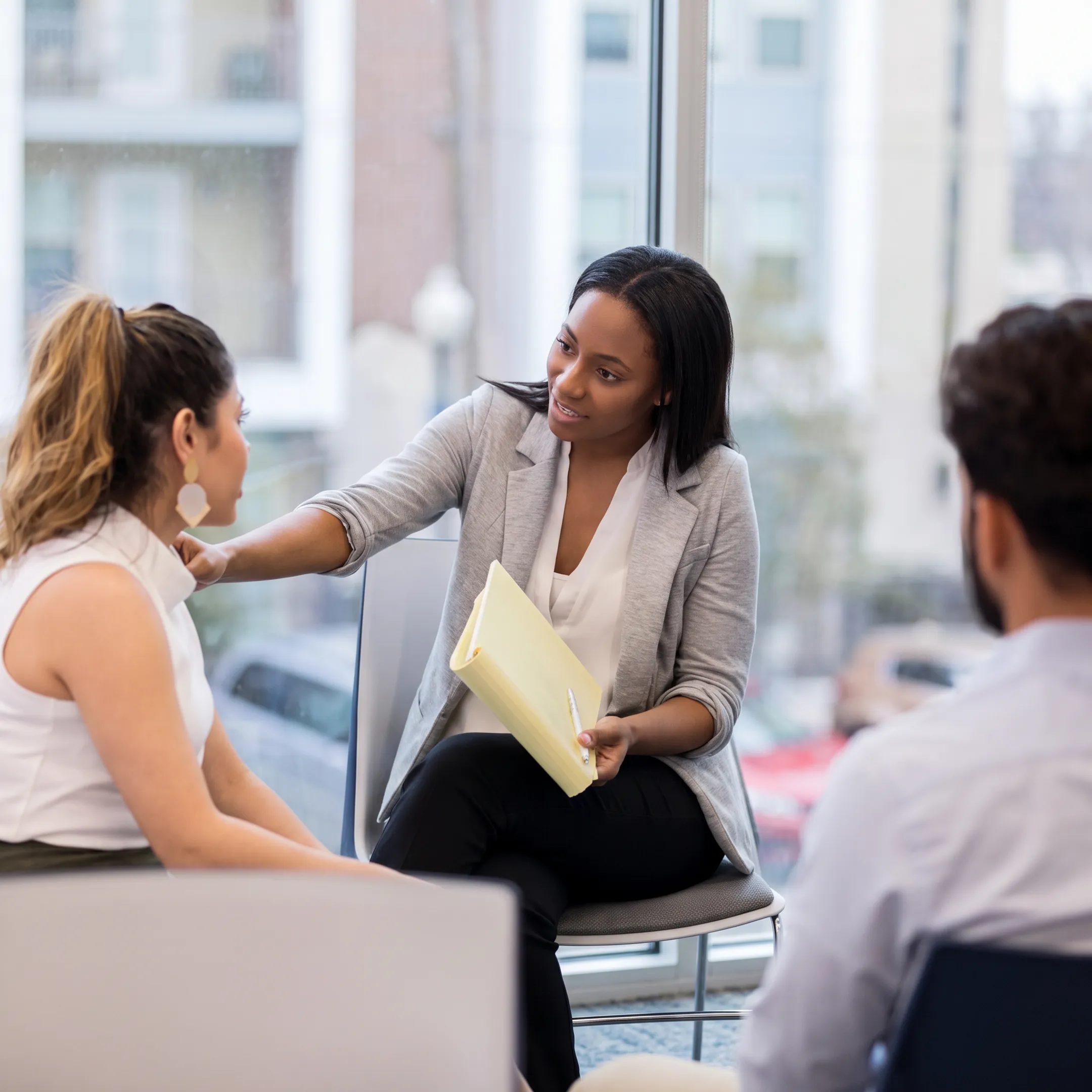 Behavioral health professional reviewing depression treatment options with an adult client