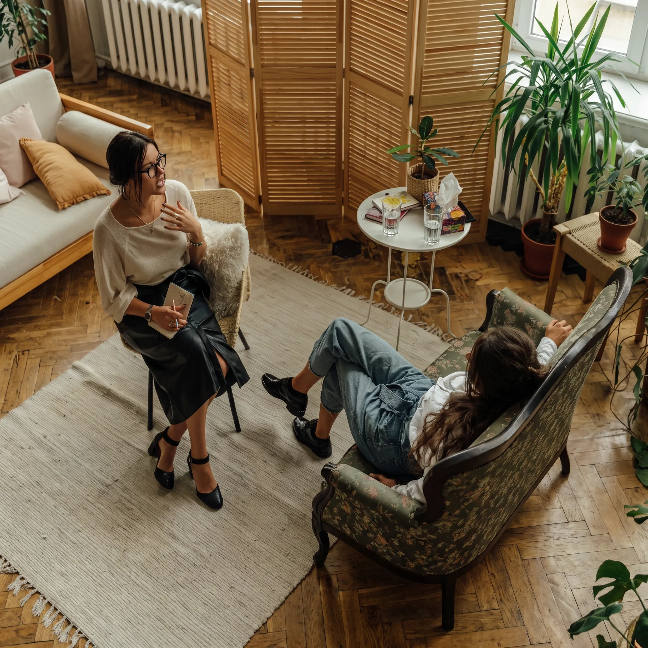 Clinician providing supportive adult mental health counseling during a treatment session