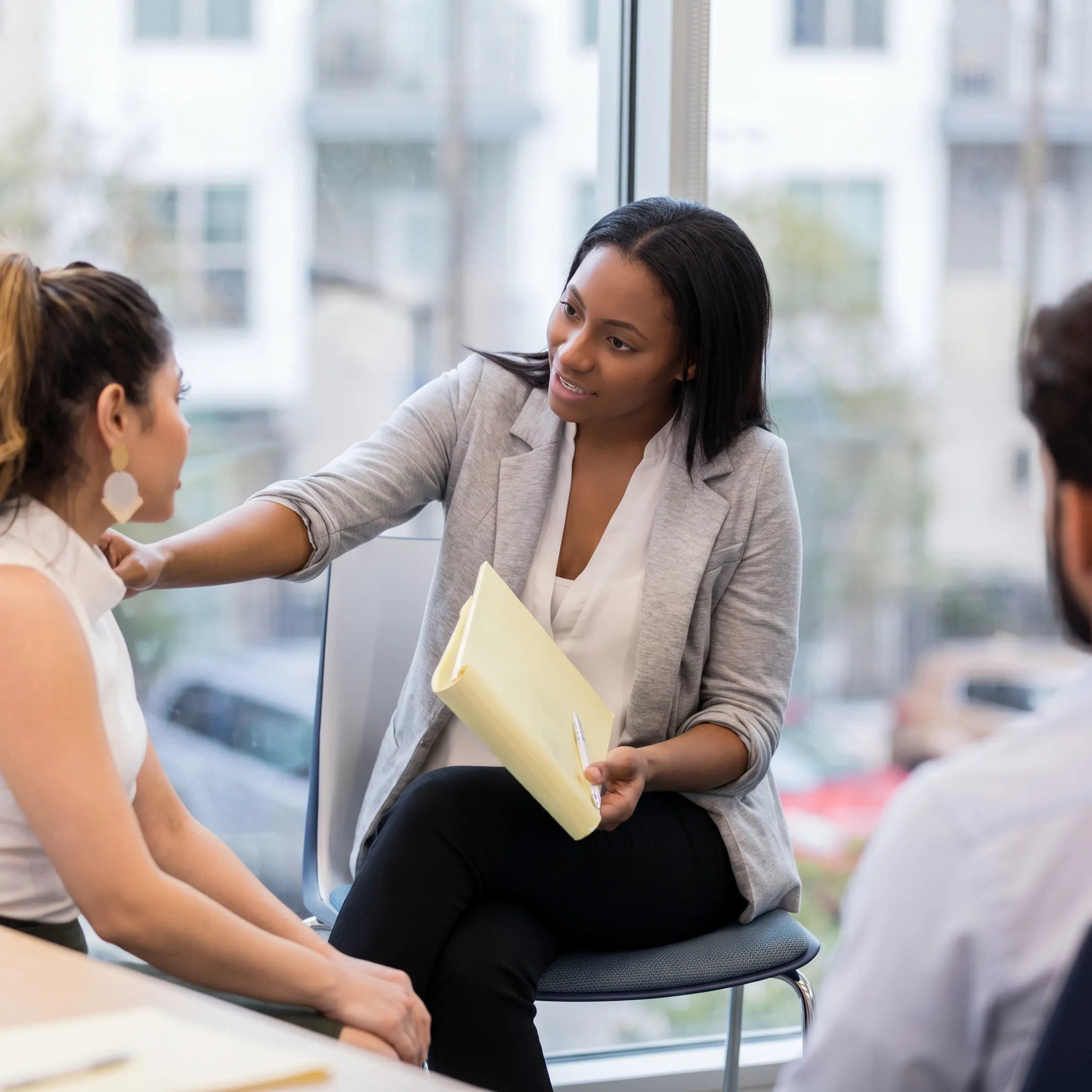 Mental health professional reviewing screening results with an adult client