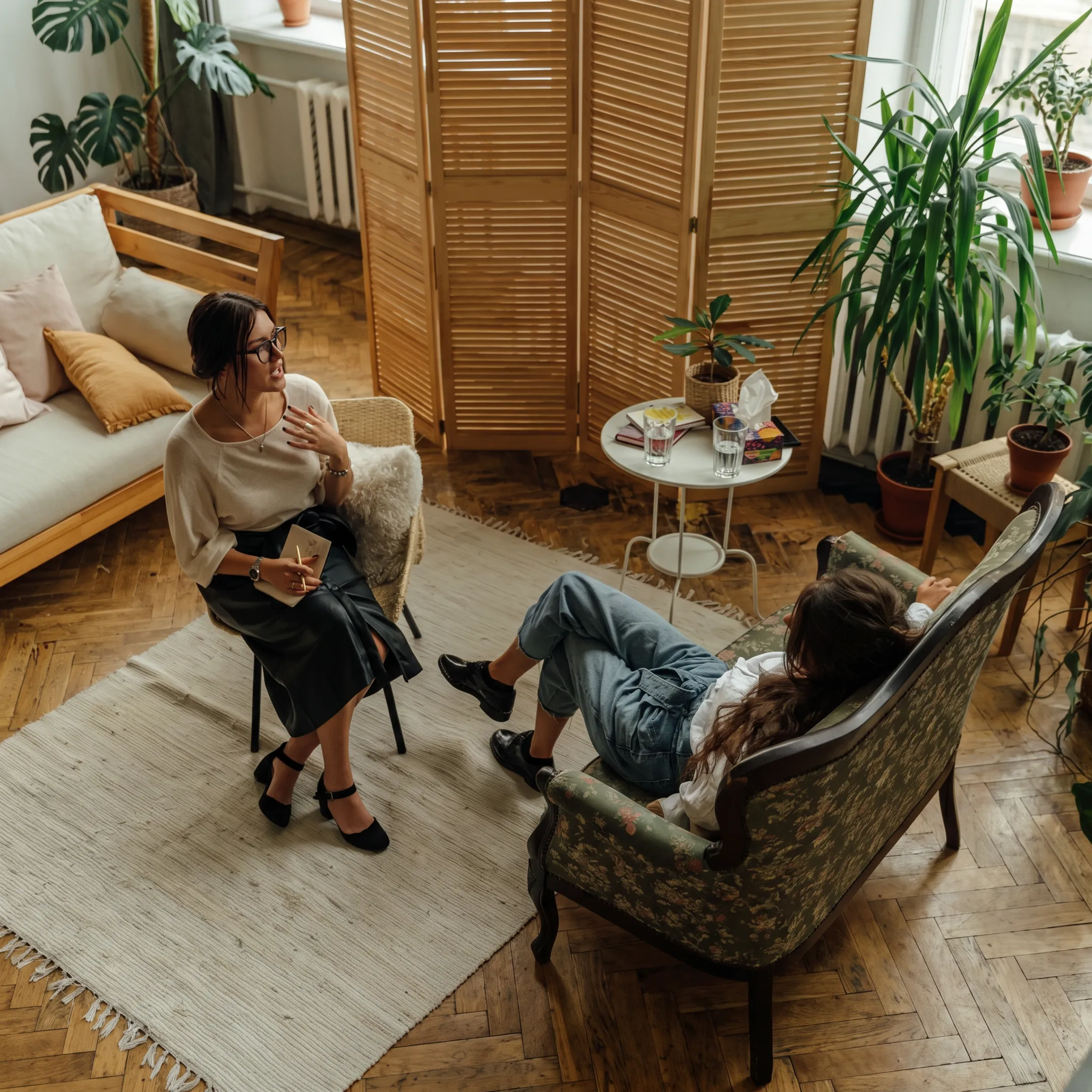 Mental health professional discussing depression symptoms with an adult client