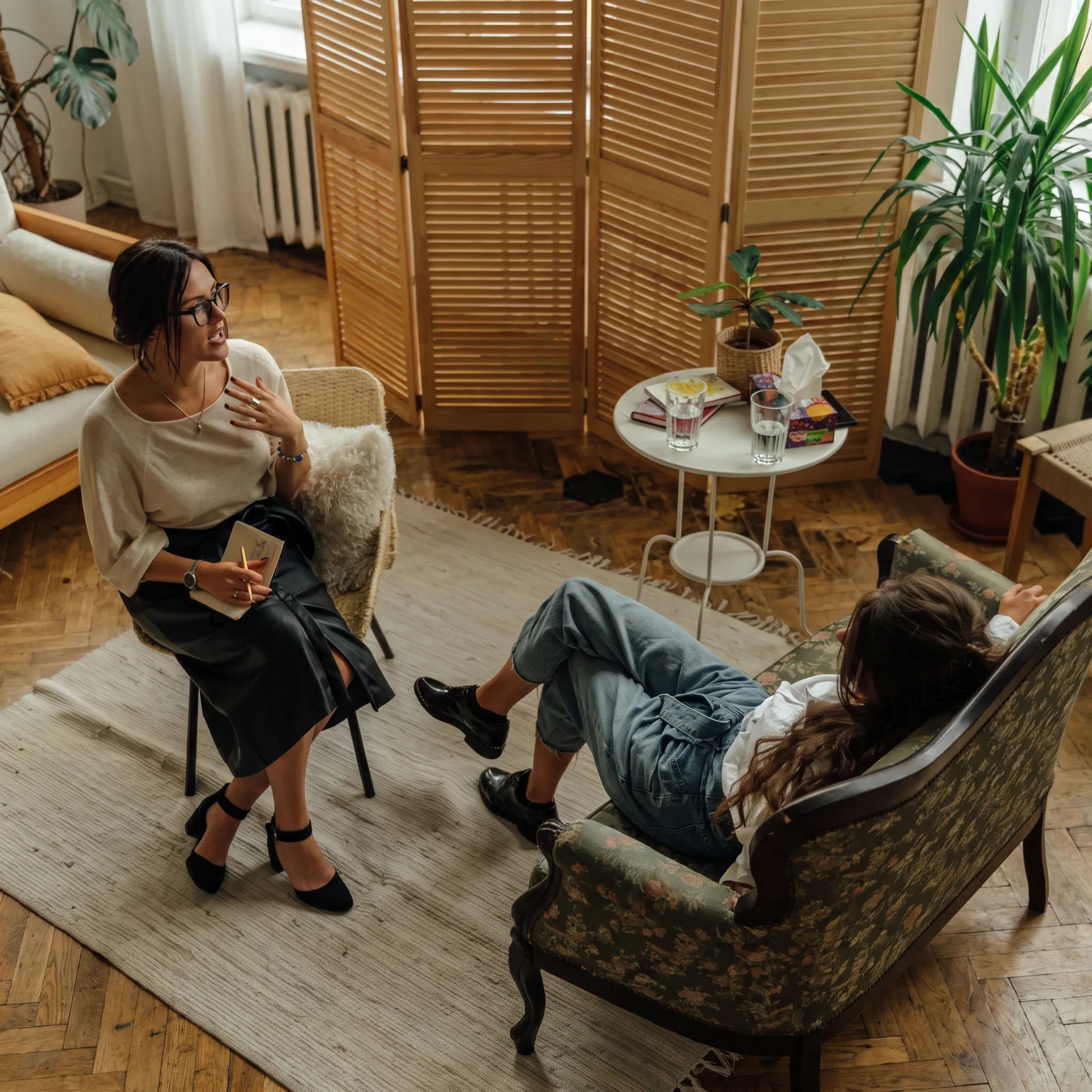 Adult inpatient mental health treatment setting with clinician supporting a client