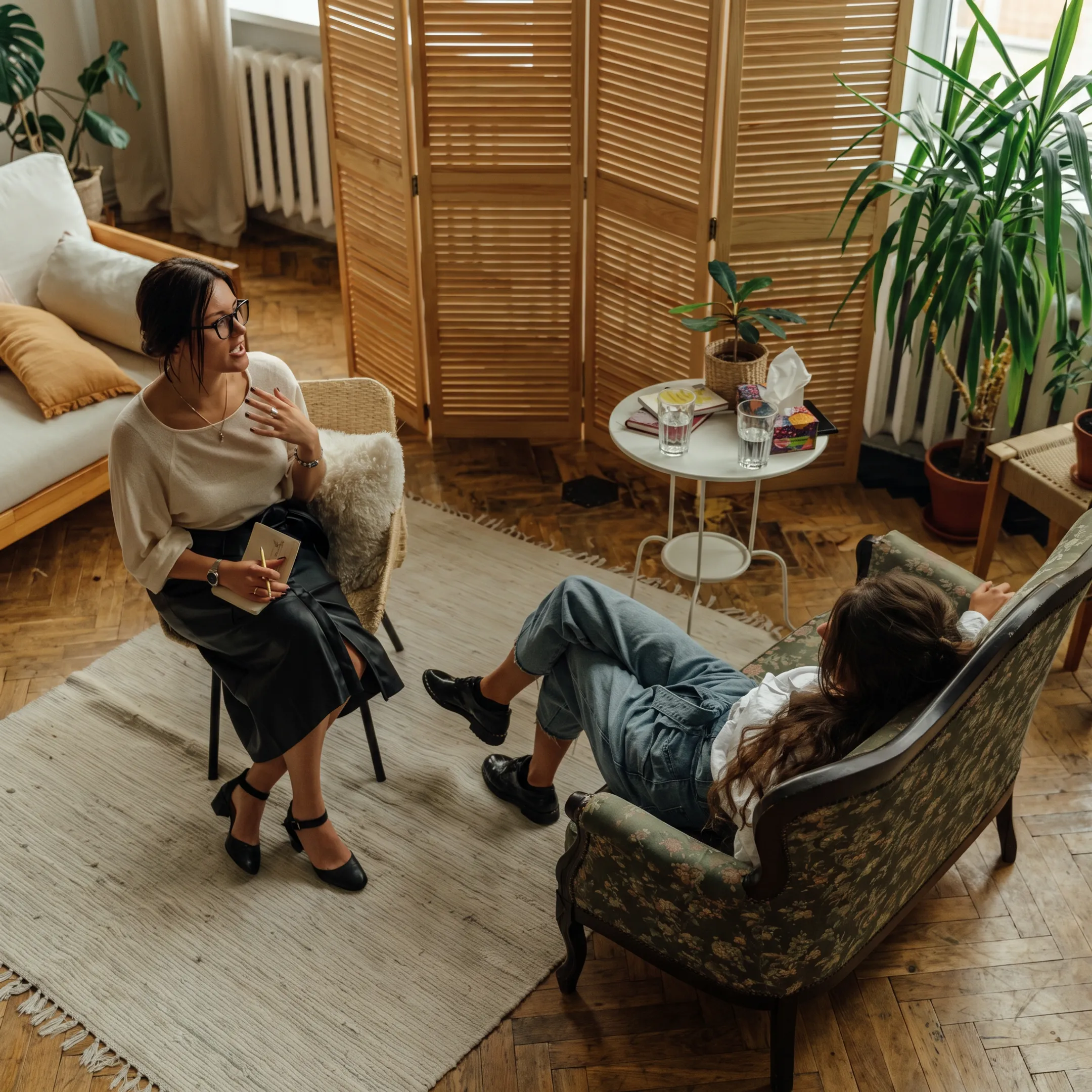 Clinician speaking with an adult client during depression therapy in a comfortable San Diego treatment setting