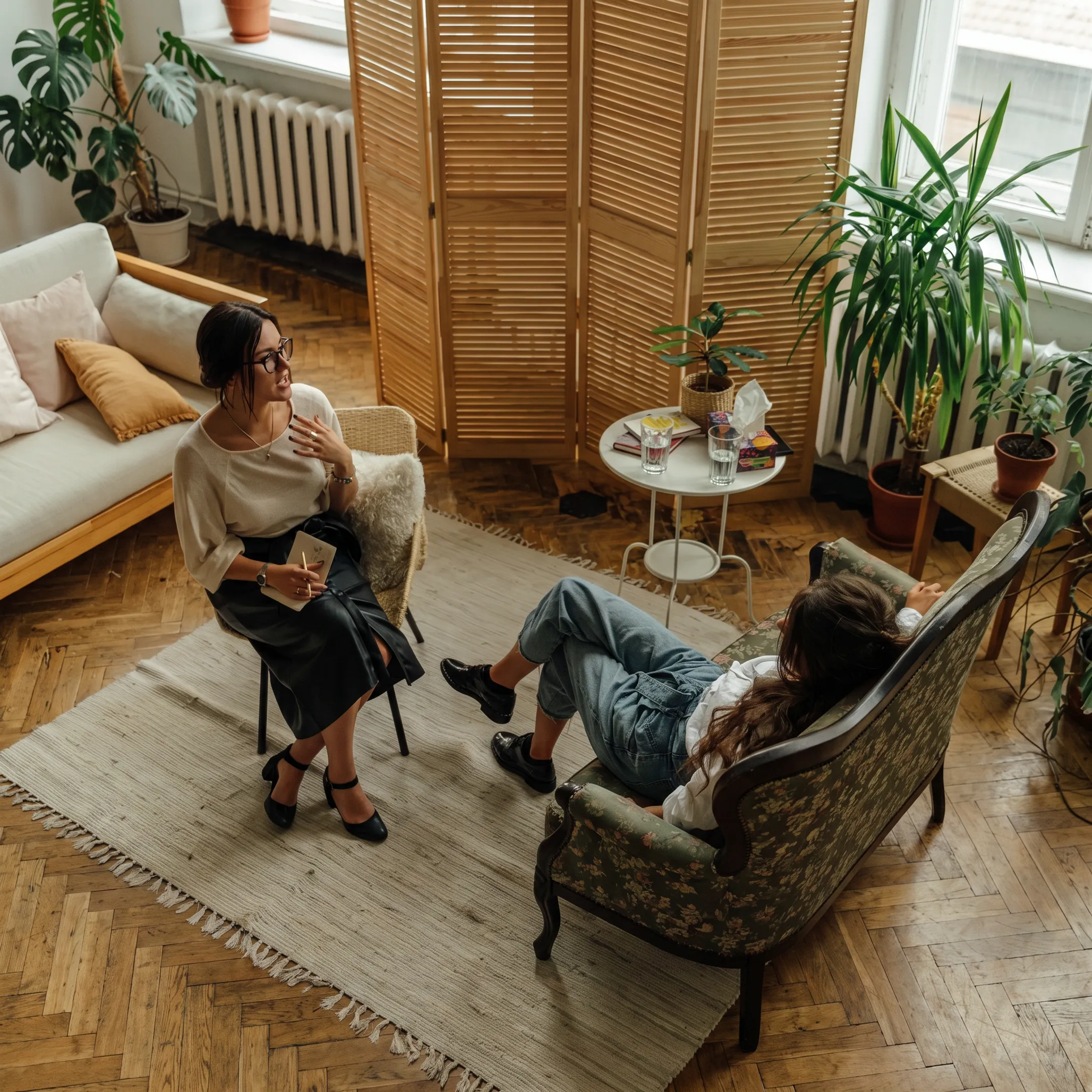 Mental health professional discussing anxiety assessment results with an adult client