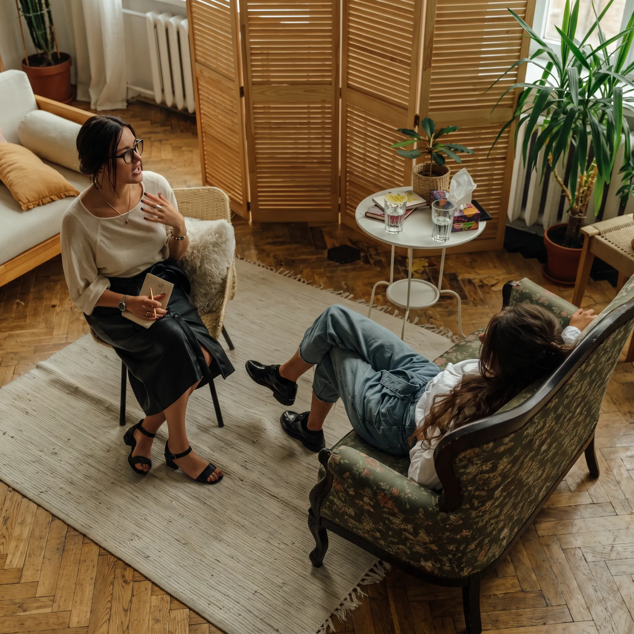 Behavioral health clinician reviewing an individualized recovery plan with an adult client