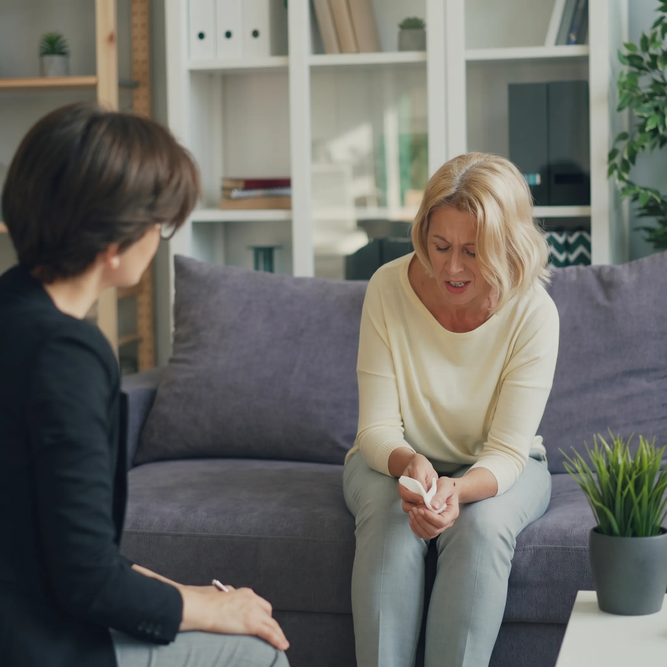 Clinician speaking with an adult client during depression treatment