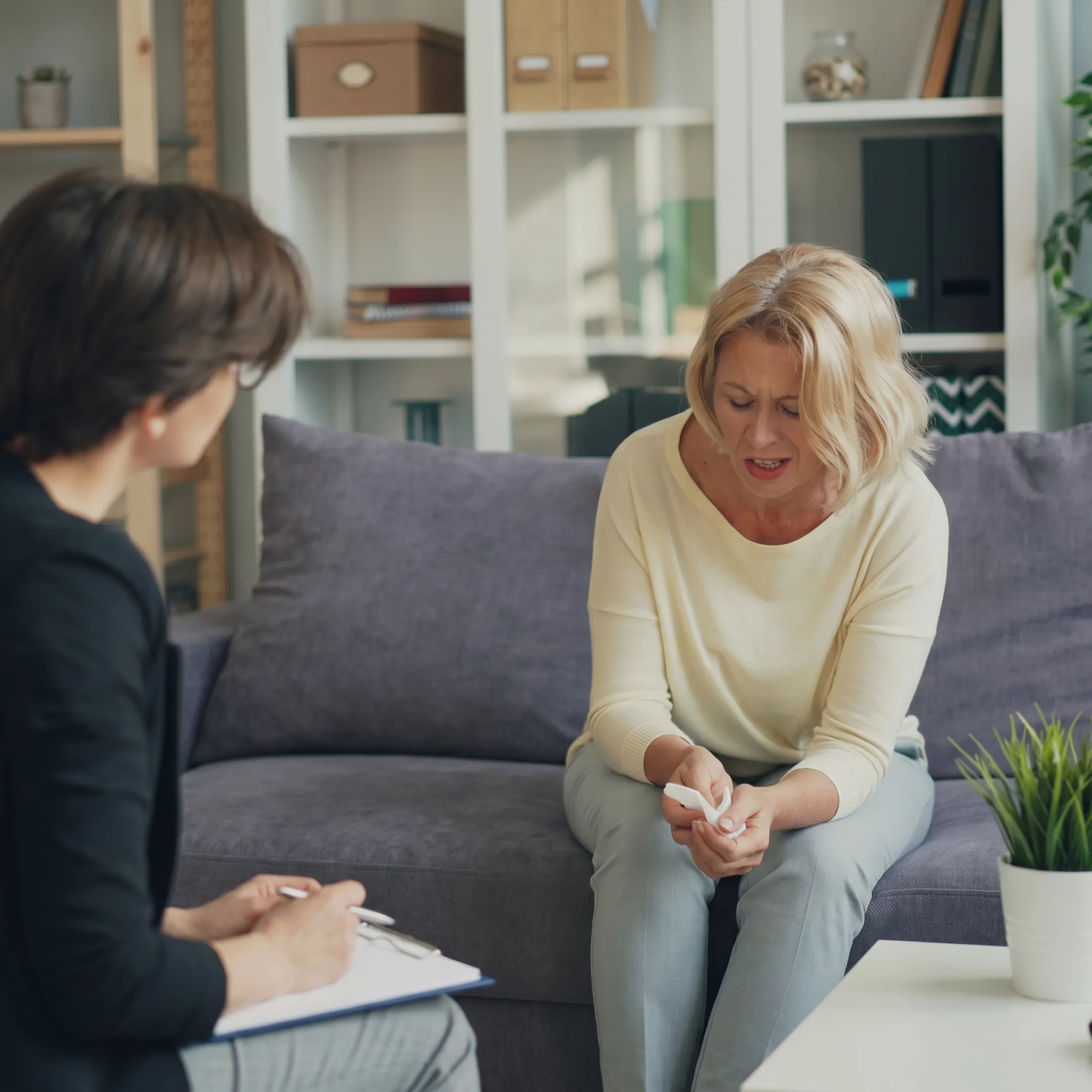 Therapist guiding an adult client through a personalized depression treatment session