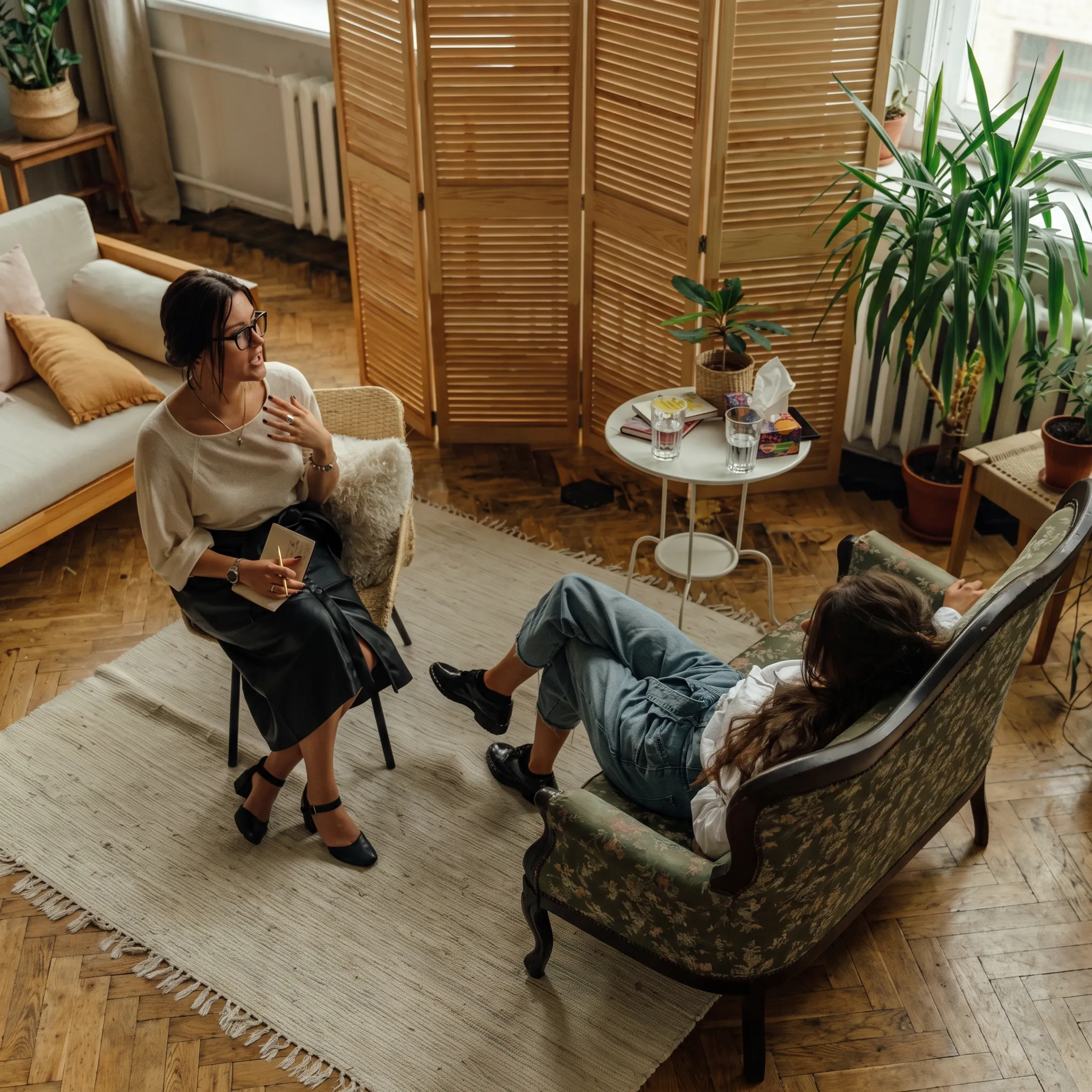 Adults participating in an online mental health group therapy session with a clinician