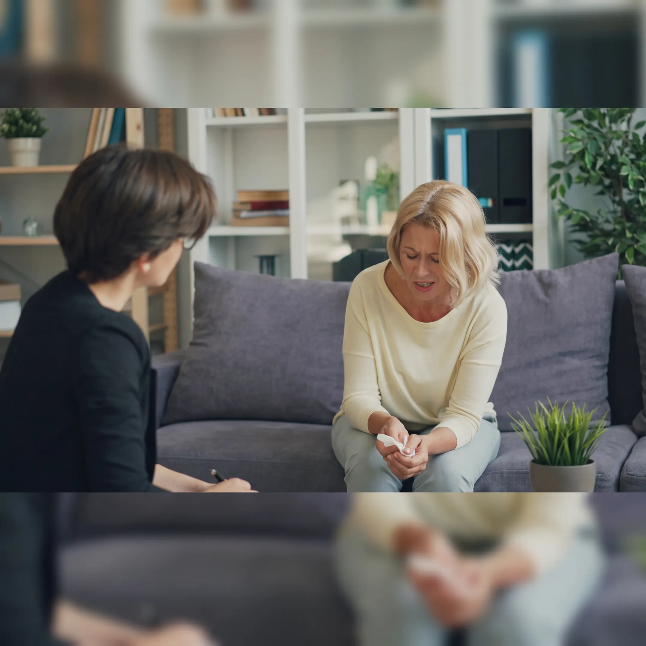 Behavioral health clinician guiding an adult client through an outpatient therapy session