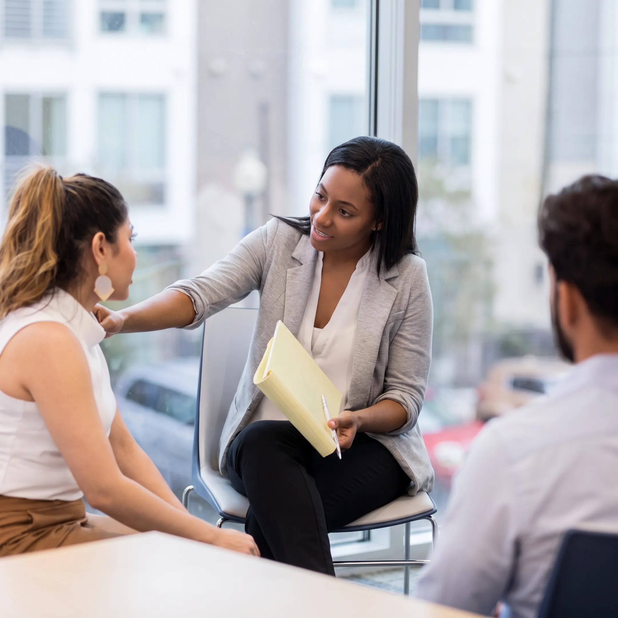 Clinician speaking with an adult during a private behavioral health assessment