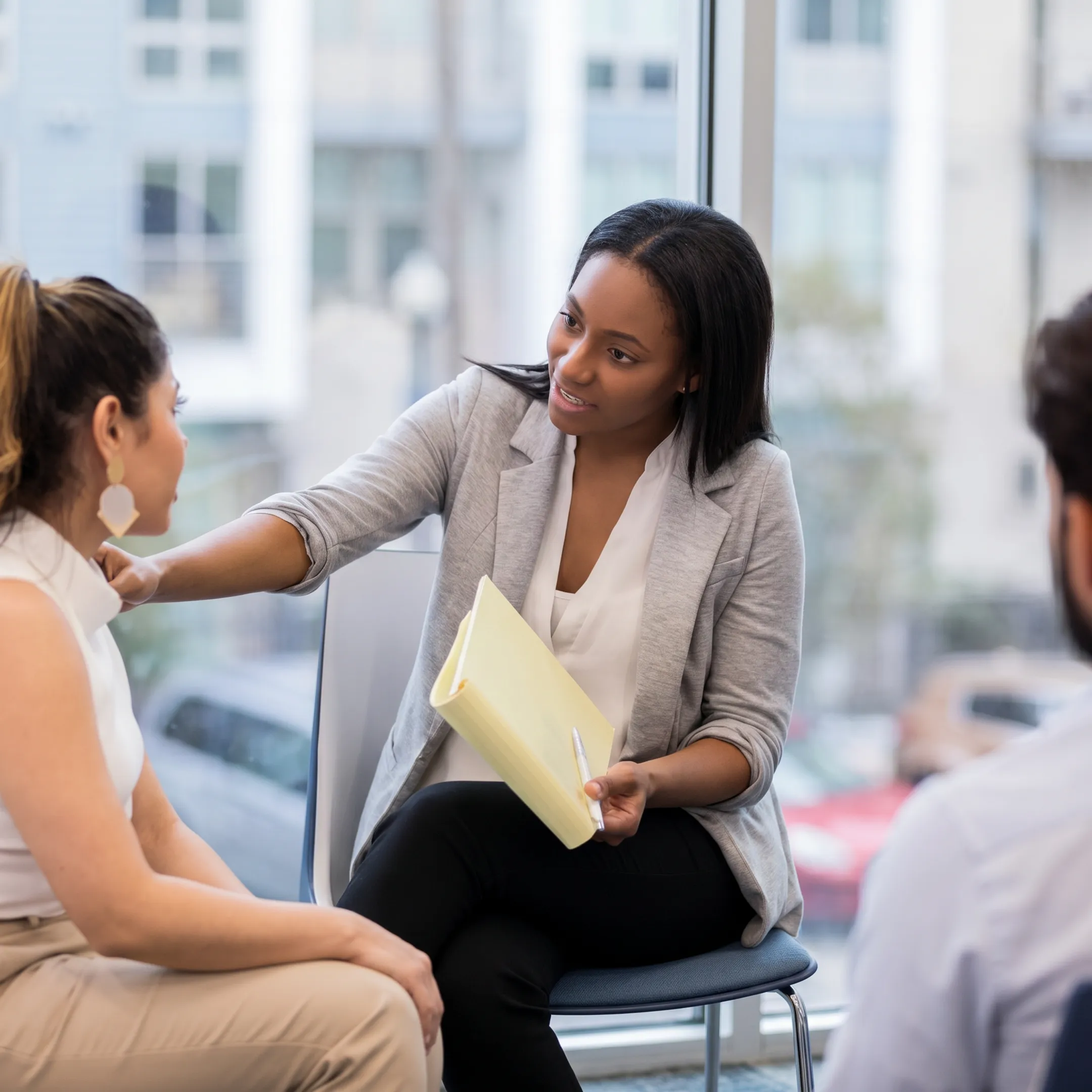 Behavioral health professional providing crisis support during a private consultation