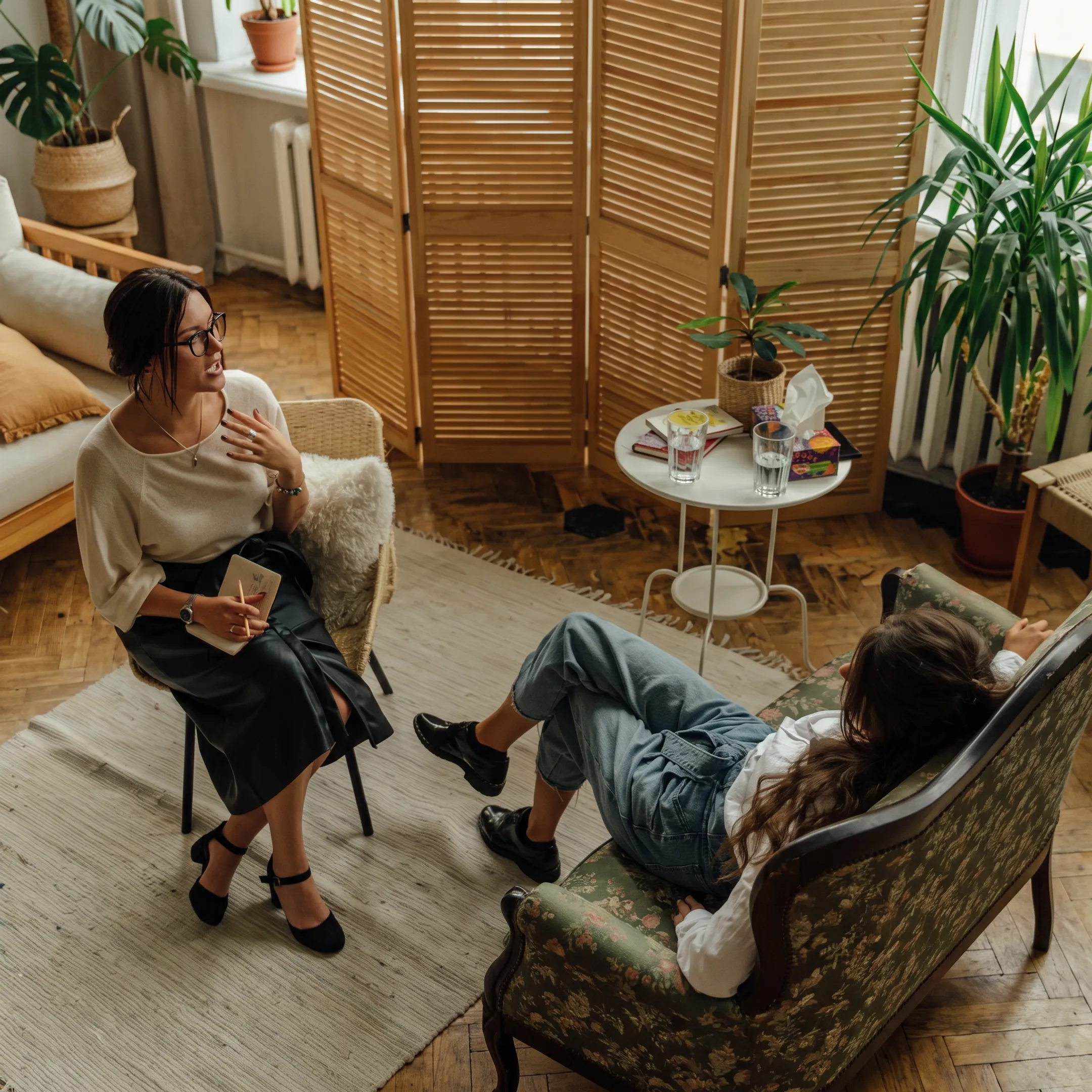 Therapist speaking with an adult client in a calm Orange County treatment setting