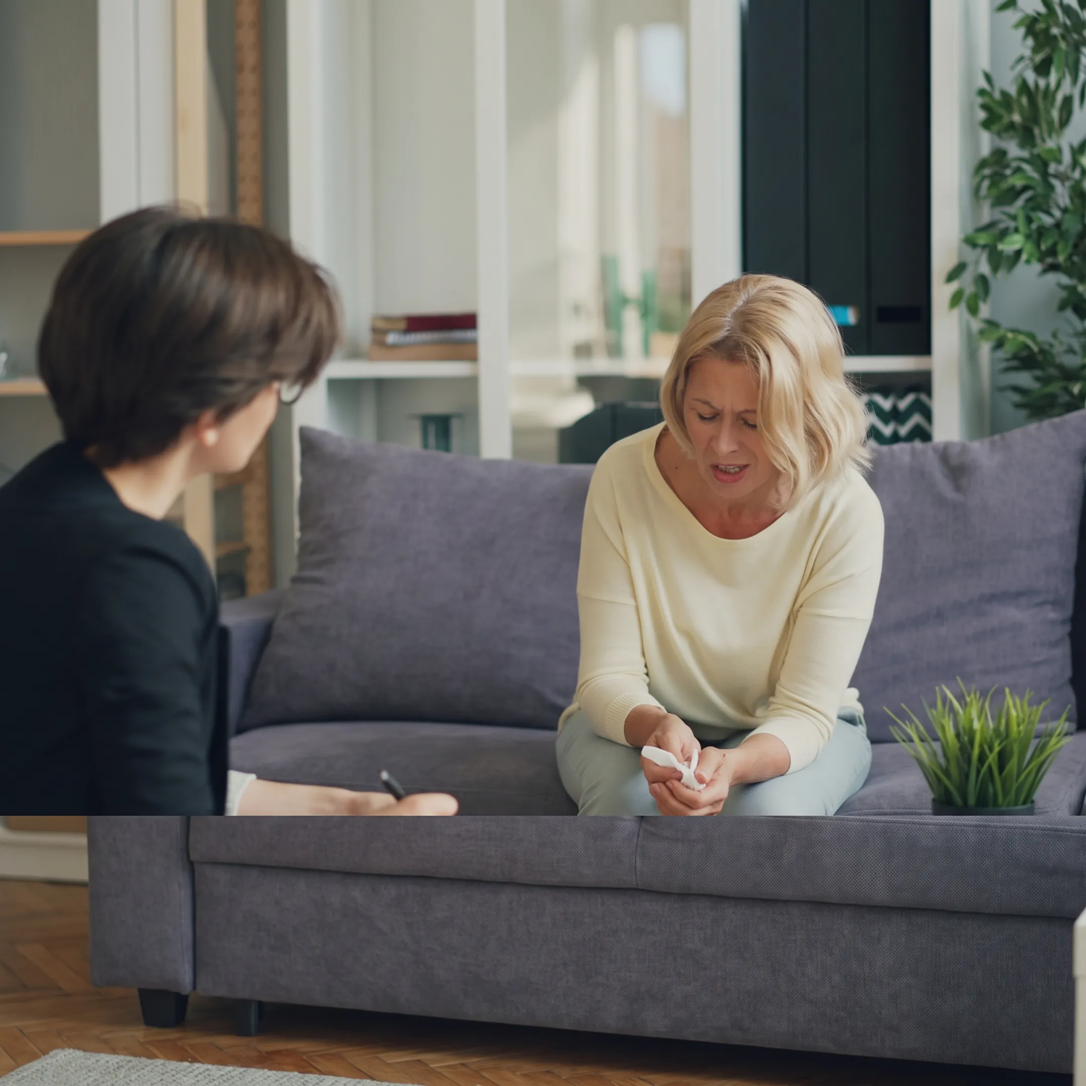 Clinician providing trauma-informed support to an adult client