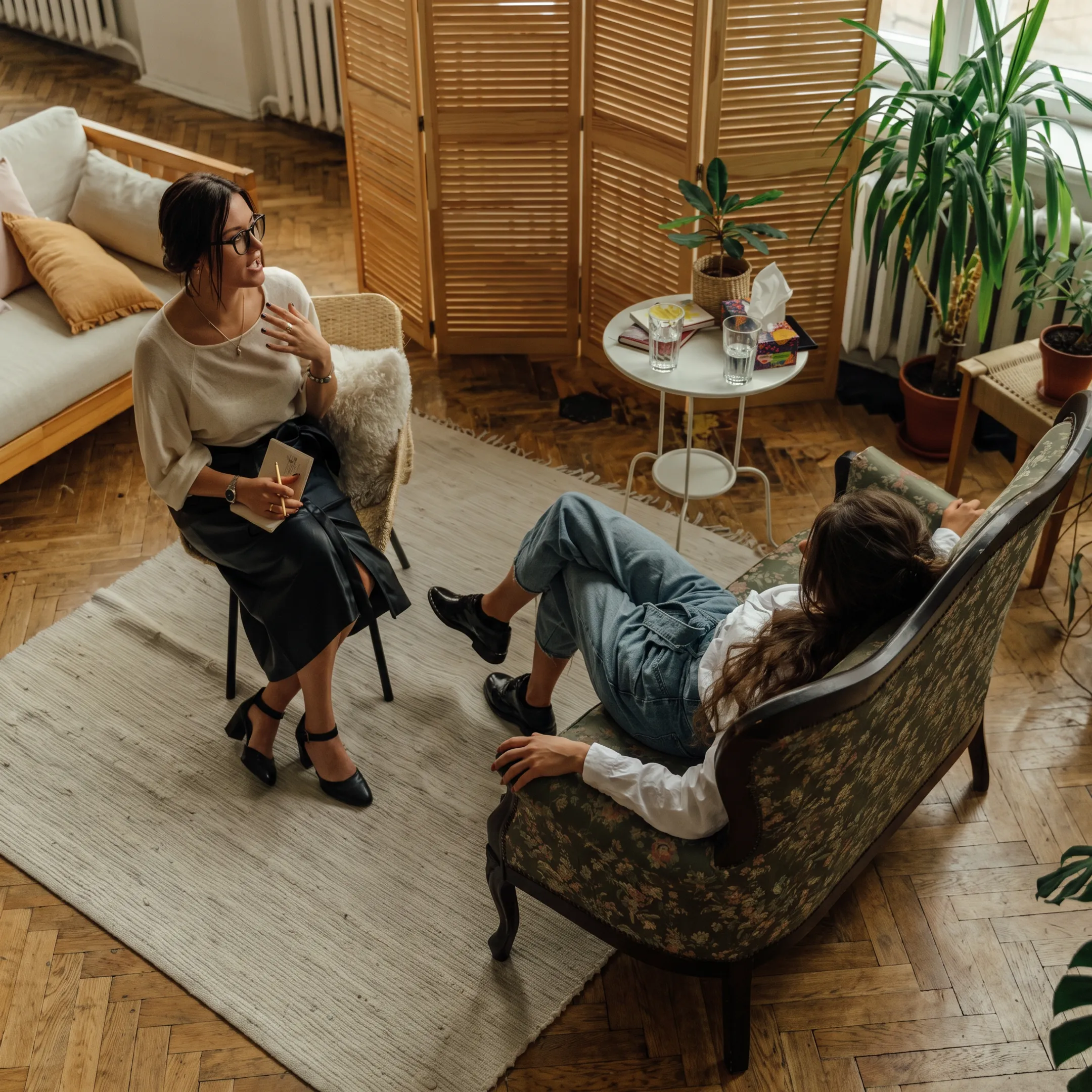 Clinician providing personalized residential mental health support to an adult client