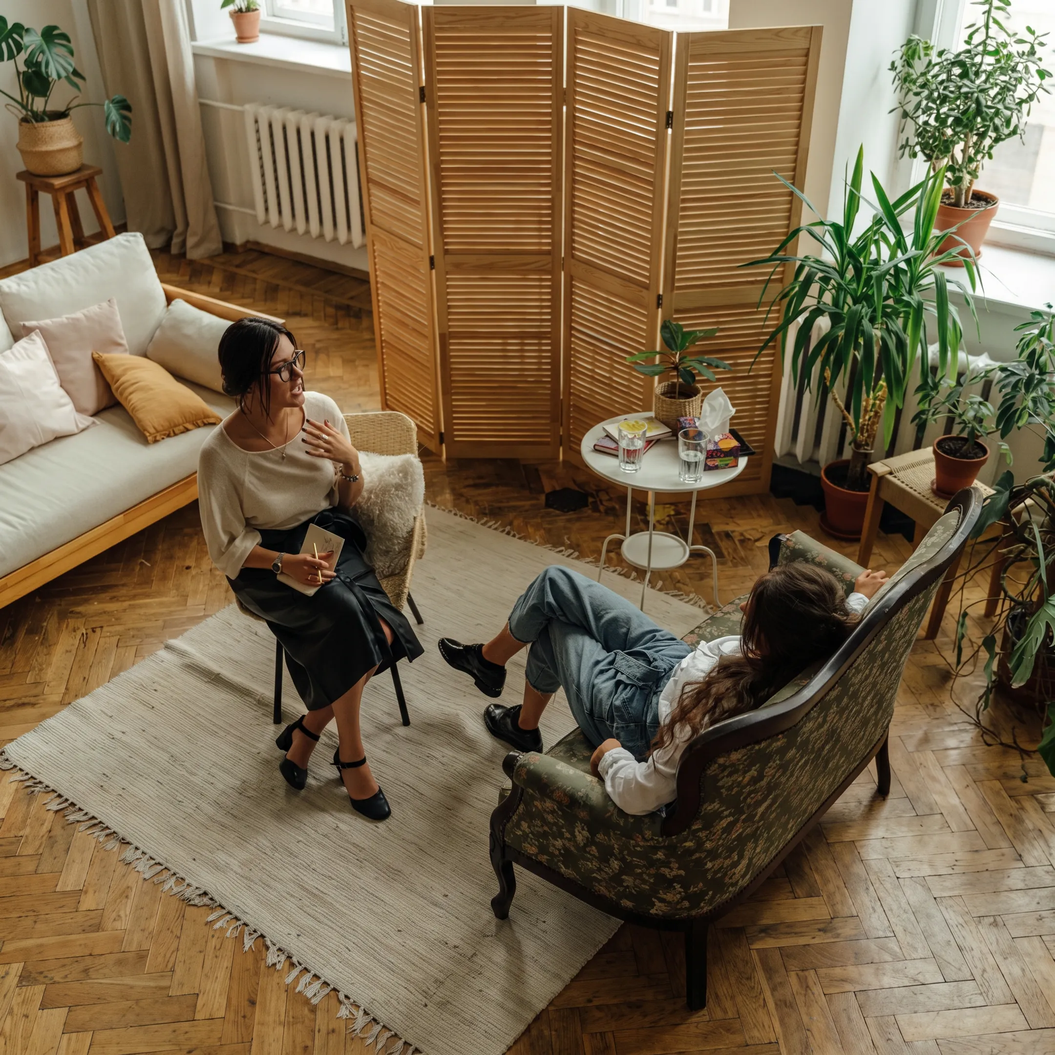 Adult receiving individualized depression treatment support from a clinician
