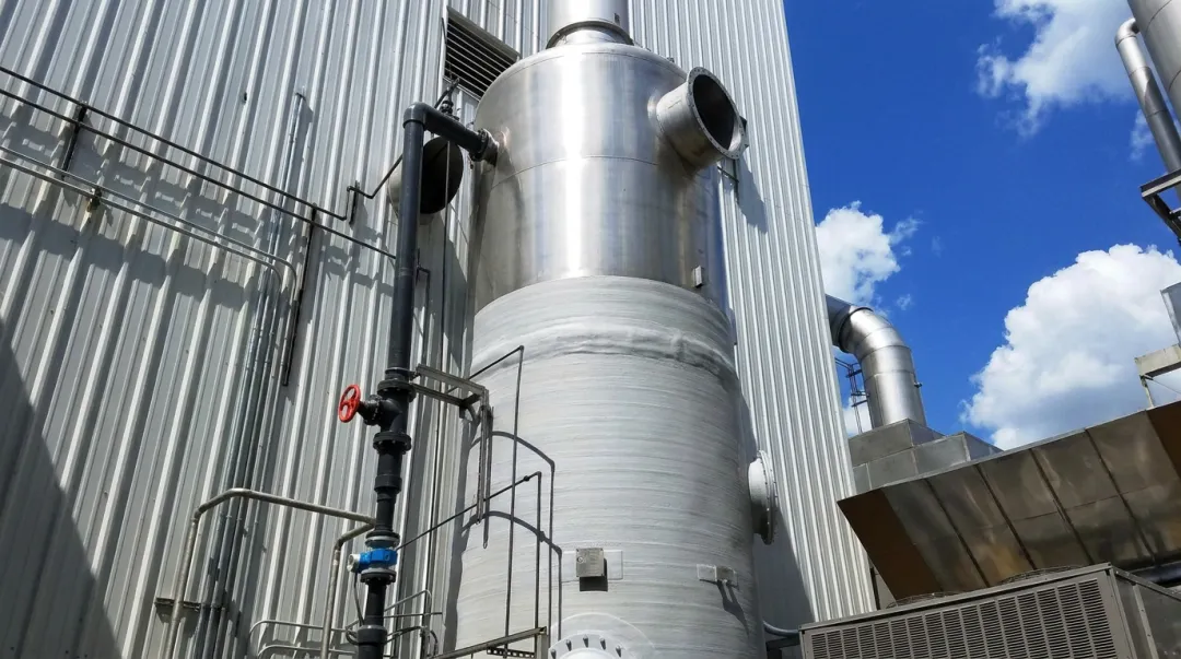 Industrial wet scrubber system with metal quench section and FRP absorber vessel