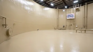 FRP-lined chemical storage tank interior after professional relining and restoration service