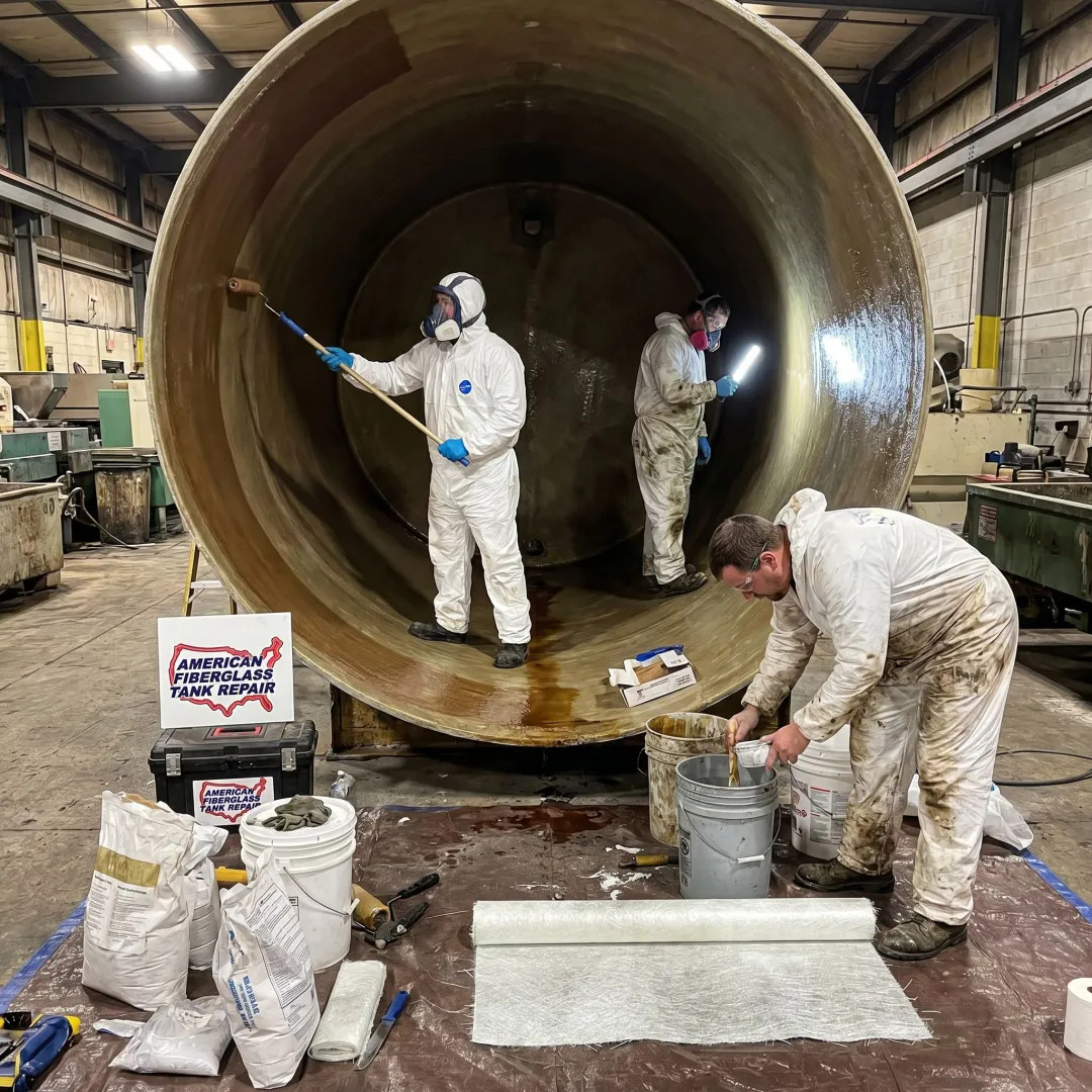 FRP tank repair crew inspecting a plating tank
