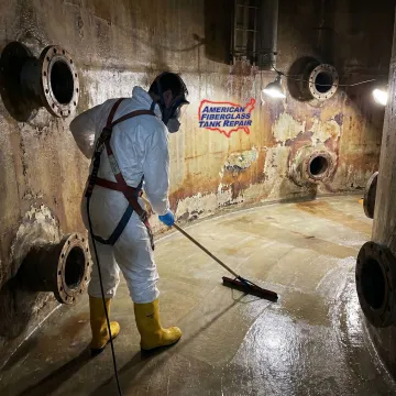 Technician repairing an FRP tank in a pulp and paper mill