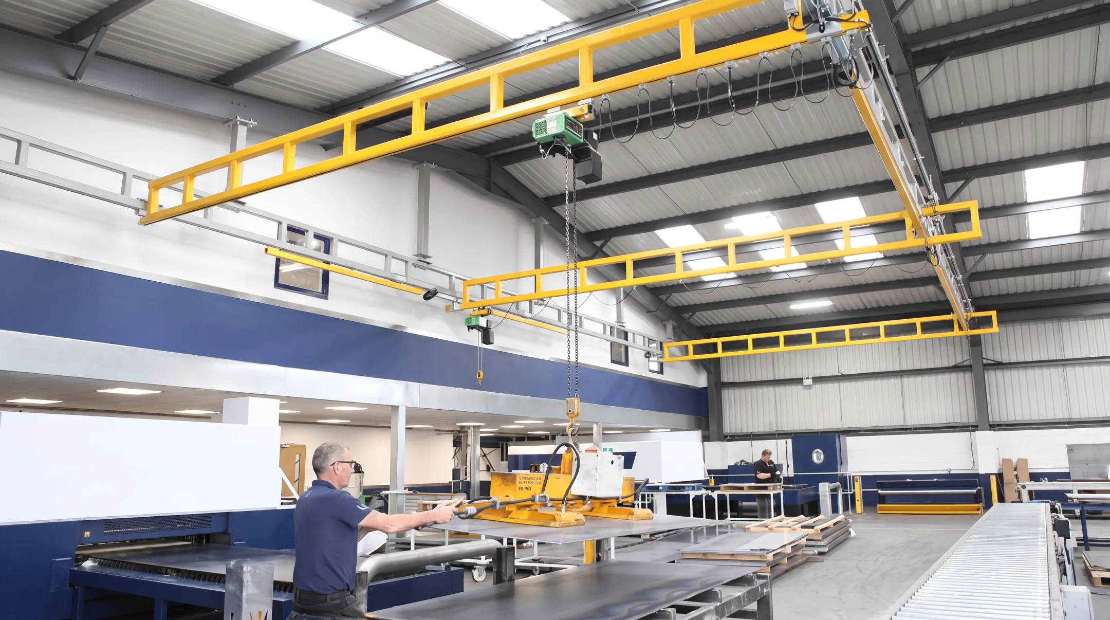 Industrial workstation crane lifting light load on assembly line
