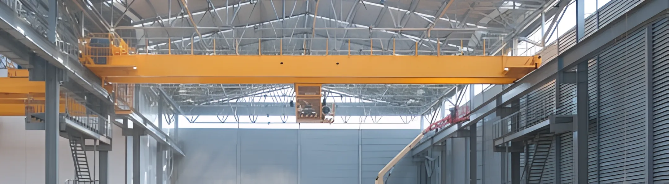 Bridge crane operating in a large warehouse