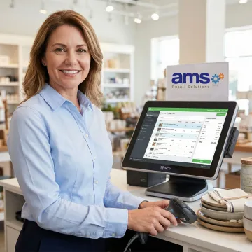 Retail store owner using NCR Counterpoint POS with barcode scanner to manage inventory