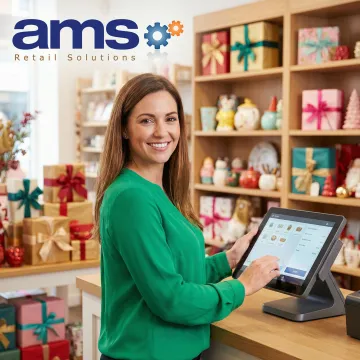 Gift shop owner using a modern point of sale system at the checkout counter