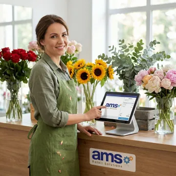 Florist using a point of sale system at a flower shop counter