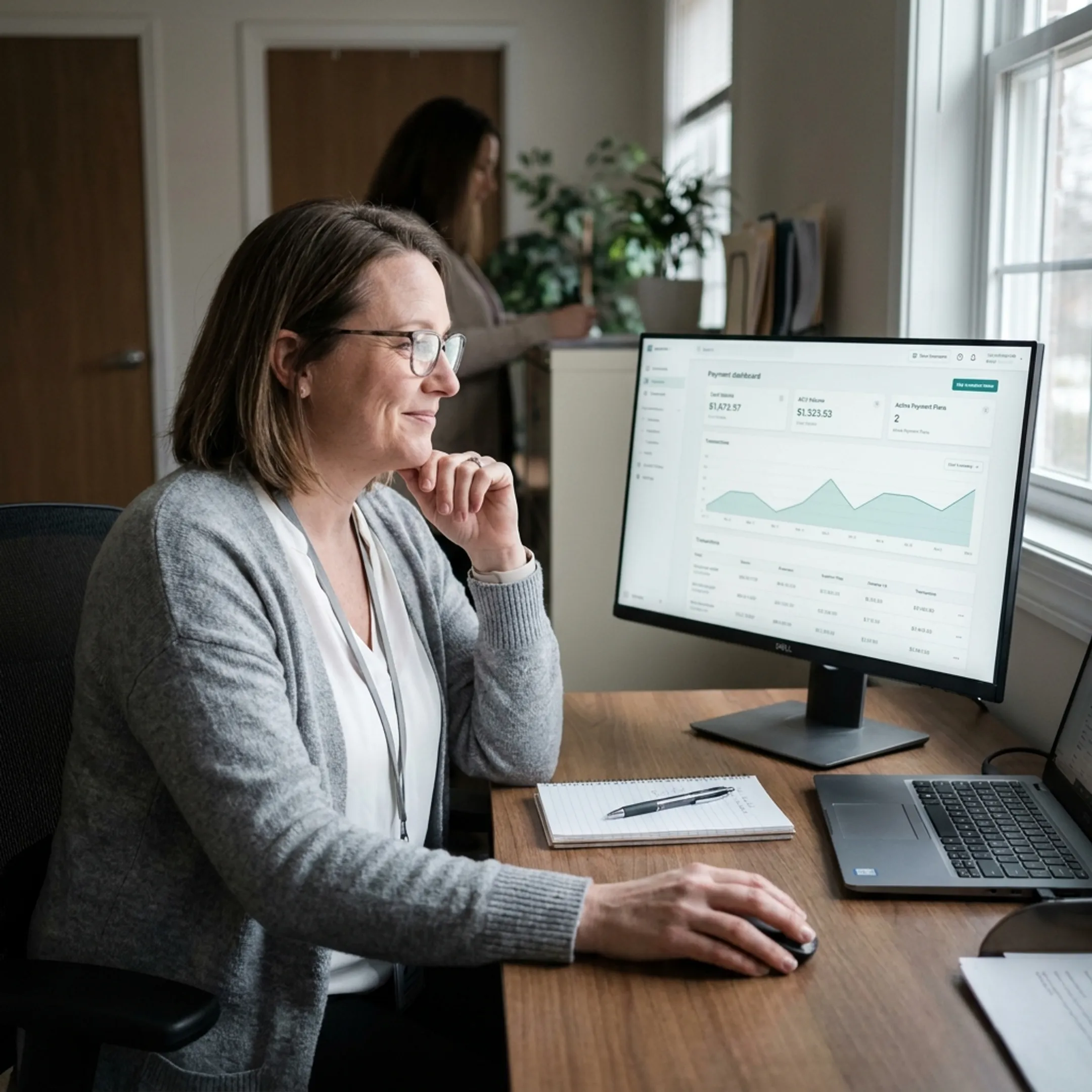 Treatment center administrator reviewing payment management dashboard