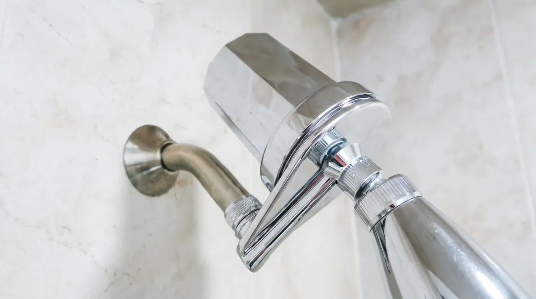 Shower filter installed on showerhead connection reducing chloramine and chlorine exposure