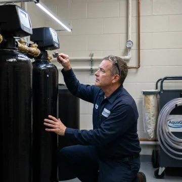 Technician servicing activated carbon filter media