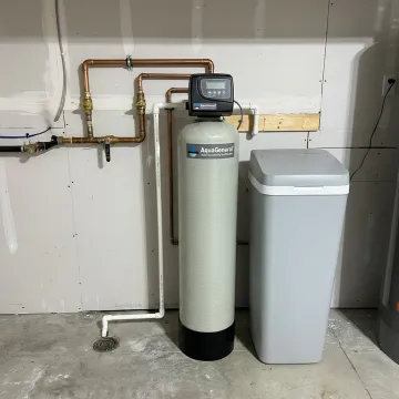 Whole-house water softener installed in a home