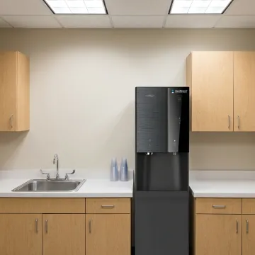 Bottleless water cooler installed in an office break room