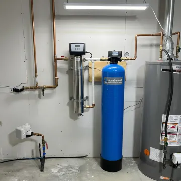 UV water purification system installed in a utility room