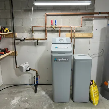 Whole-house water softener installed in an Alvin home