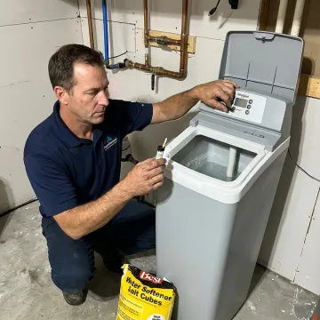 Technician inspecting a residential water softener