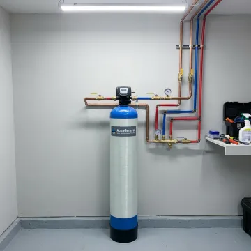 Whole house water filtration system installed in a home