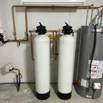 Whole house water filtration system installed in a home